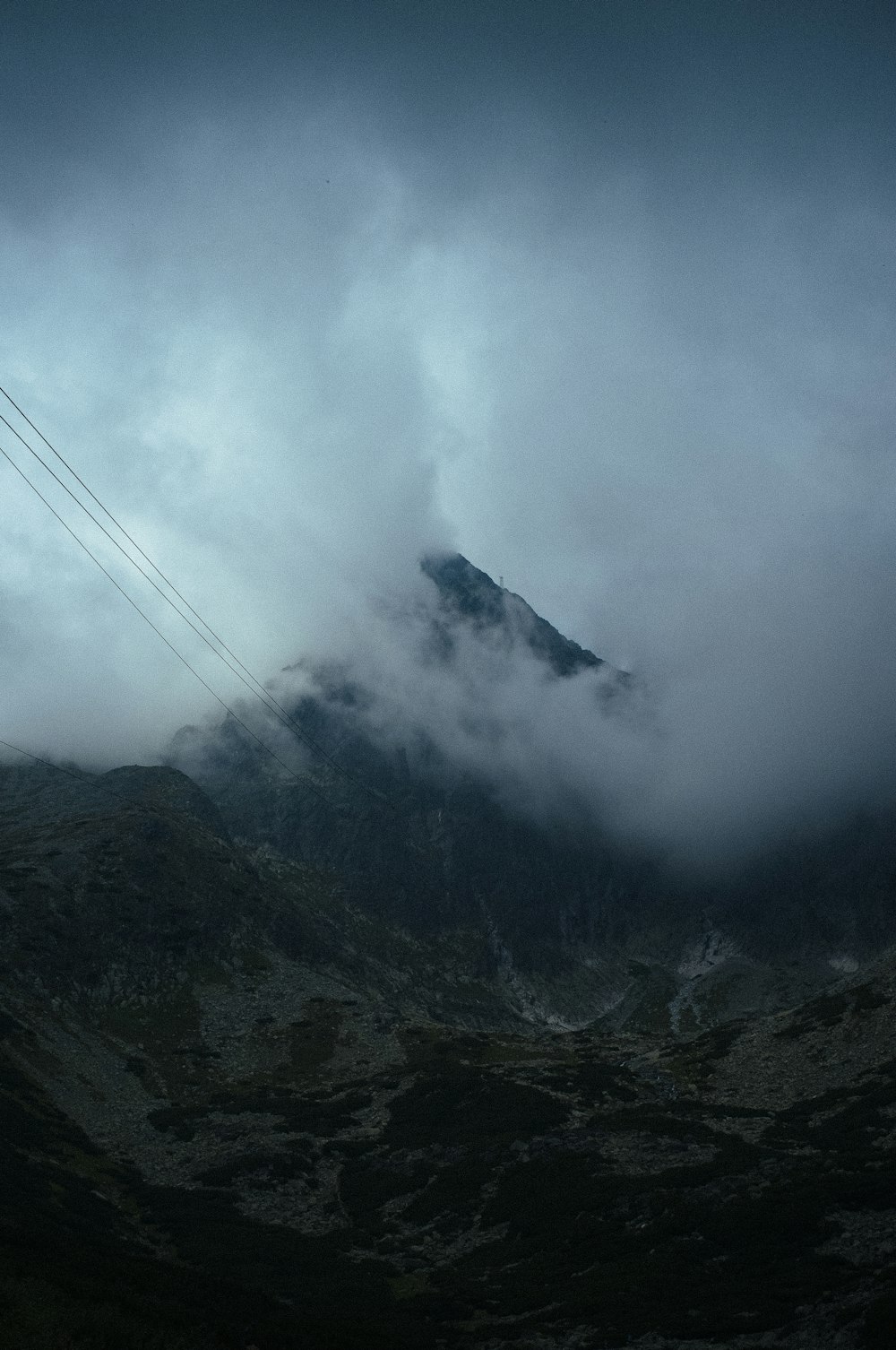 mountain covered with white clouds