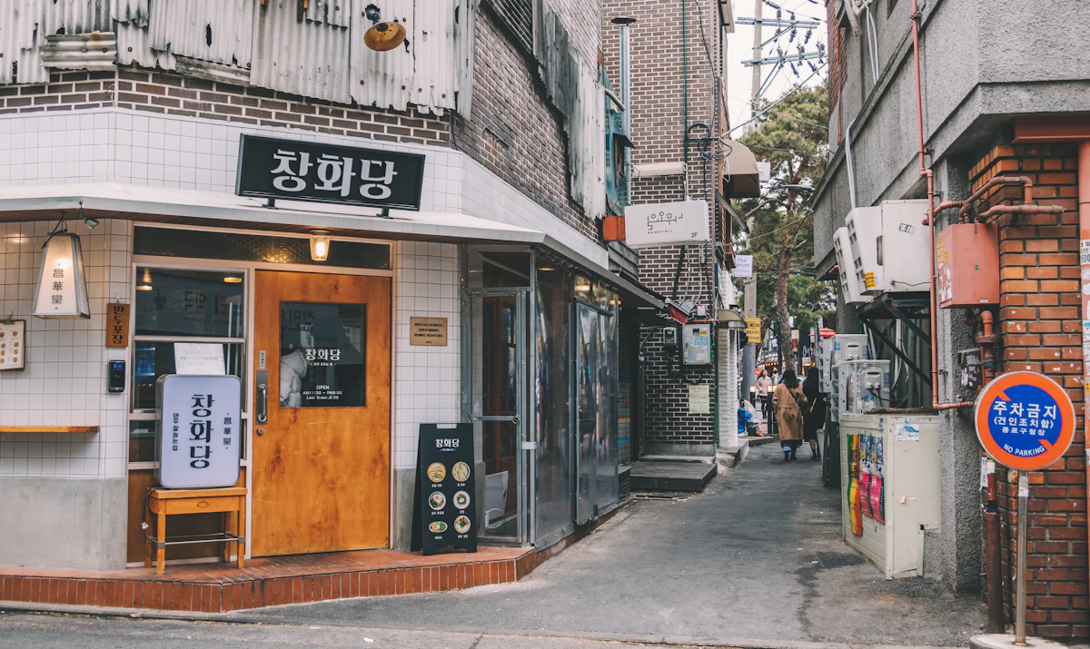 A weathered wooden door of a traditional Korean house