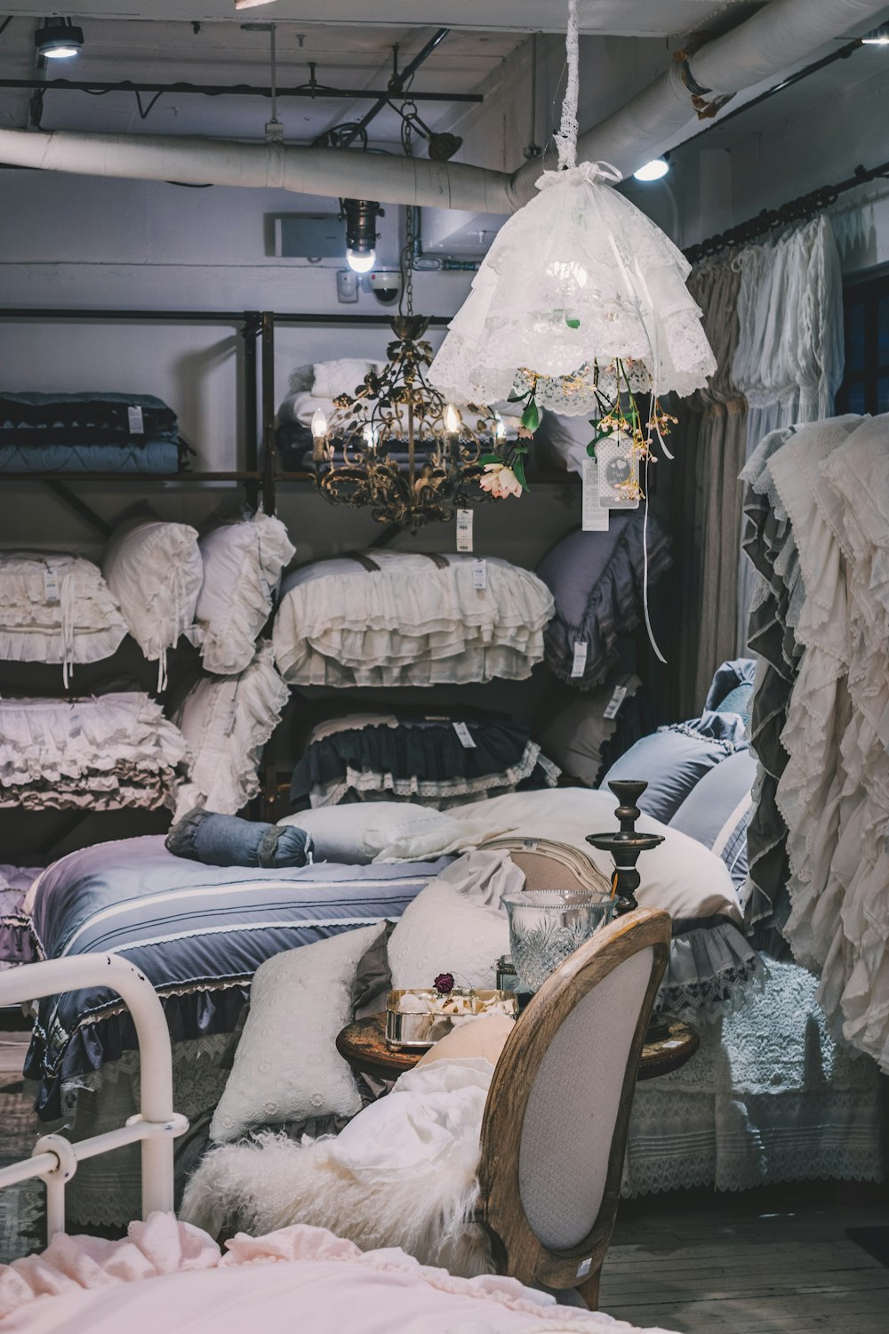 a room filled with lots of furniture and a chandelier