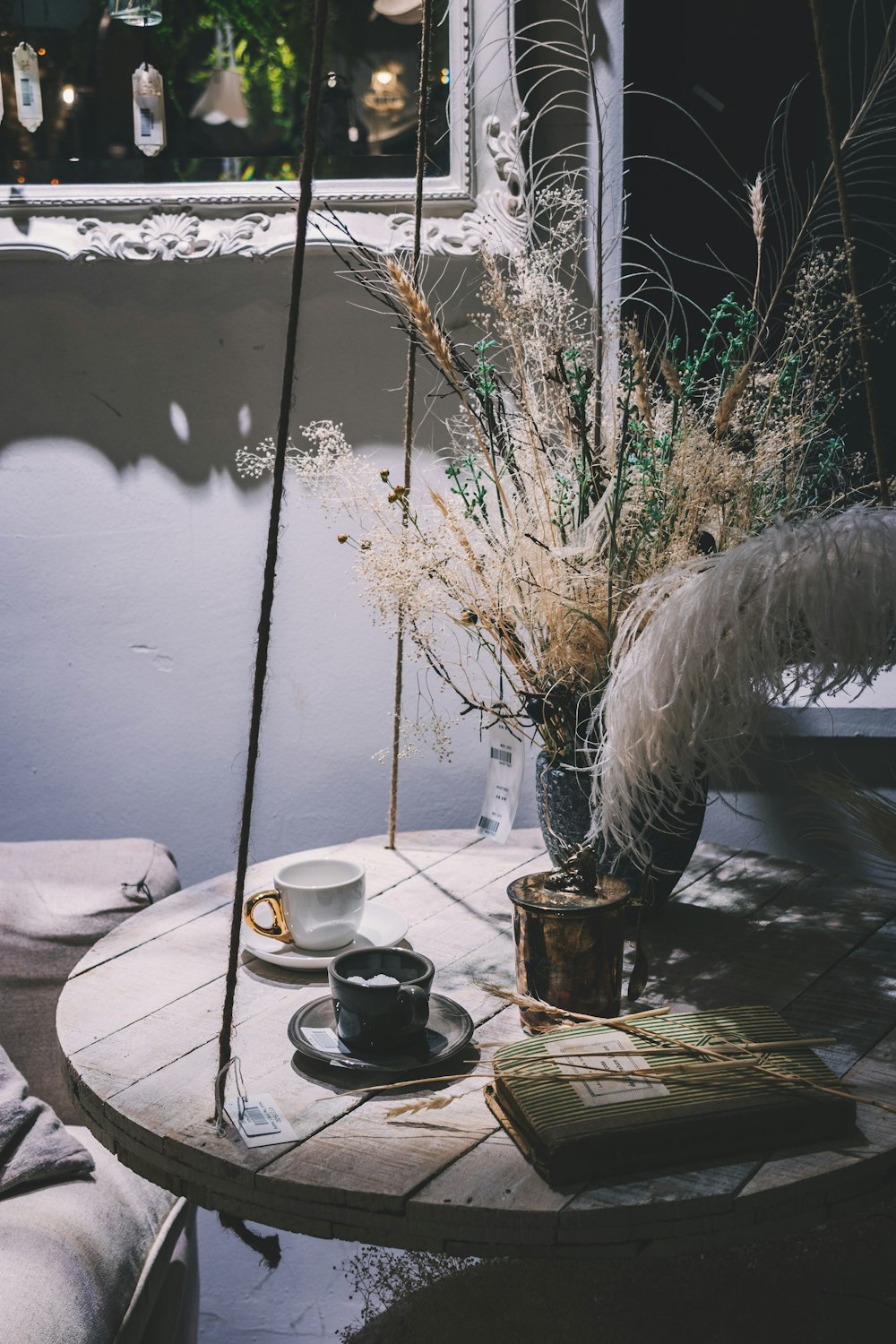 two black and white cups on brown wooden table