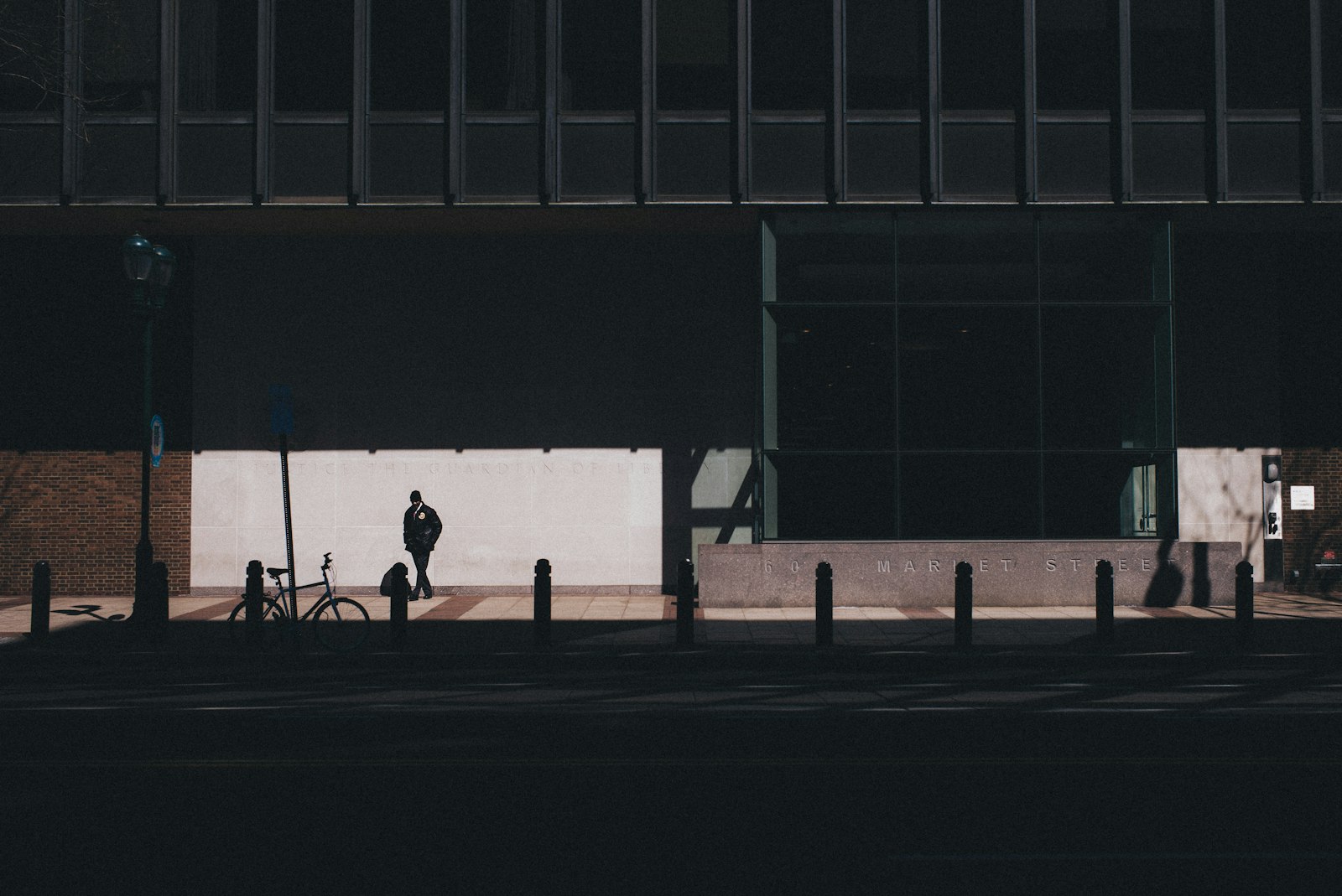 Summicron-M 1:2/35 ASPH. sample photo. Man walking near bicycle photography