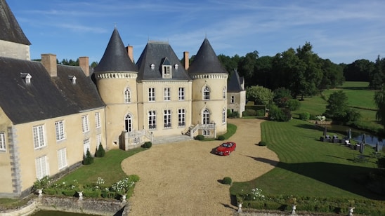 Elegant castle venue in France set for a luxury wedding with scenic gardens and historic architecture.