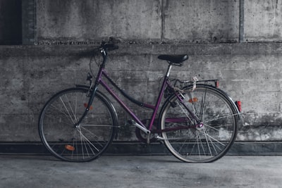 purple and black beach cruiser bicycle wheel zoom background