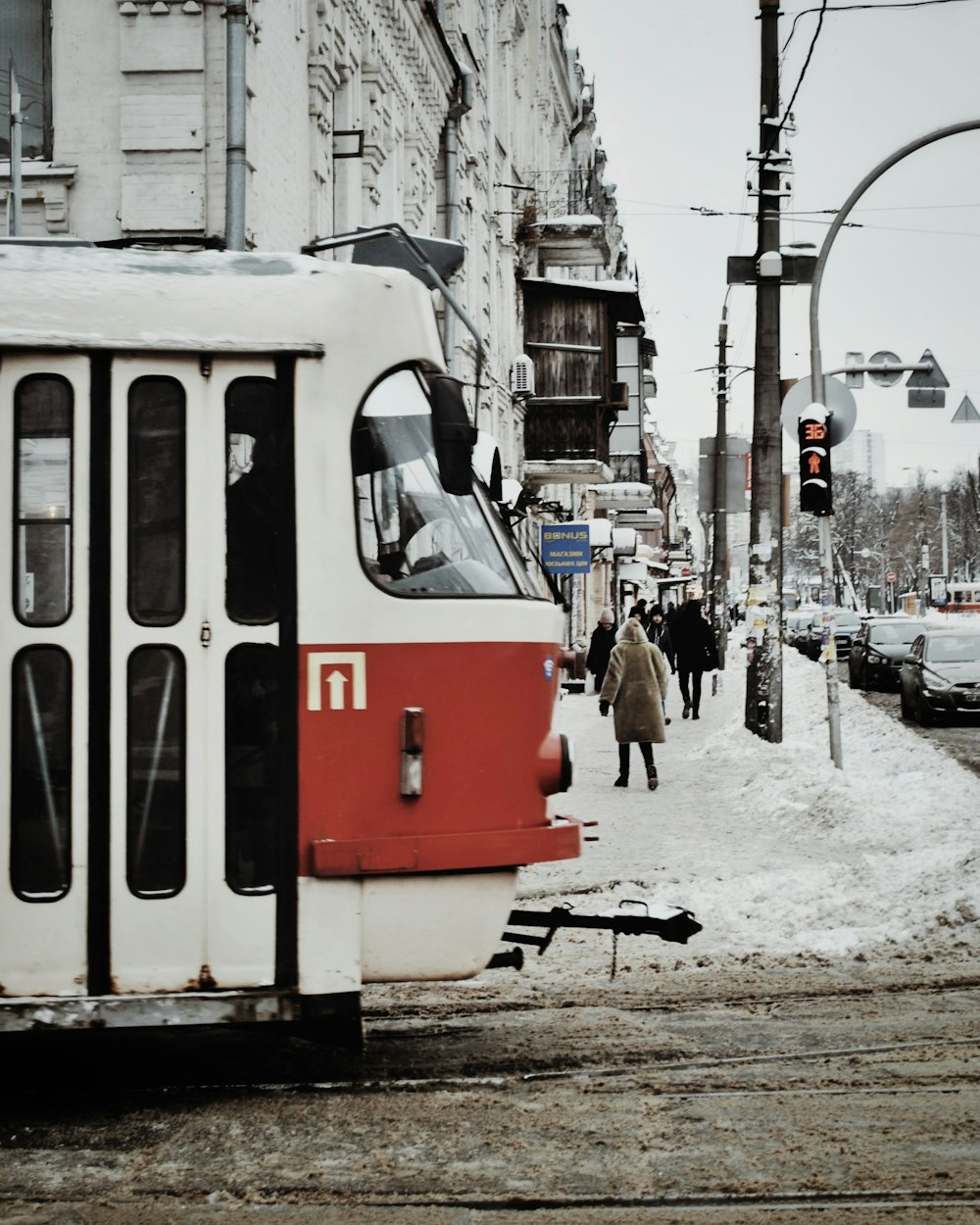 white and orange train during daytime