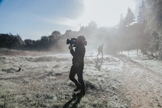 A moody still from Umesh showing the protagonist walking through a misty Goan village at dawn.