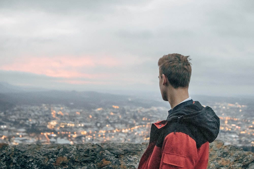 man in red and black hoodie