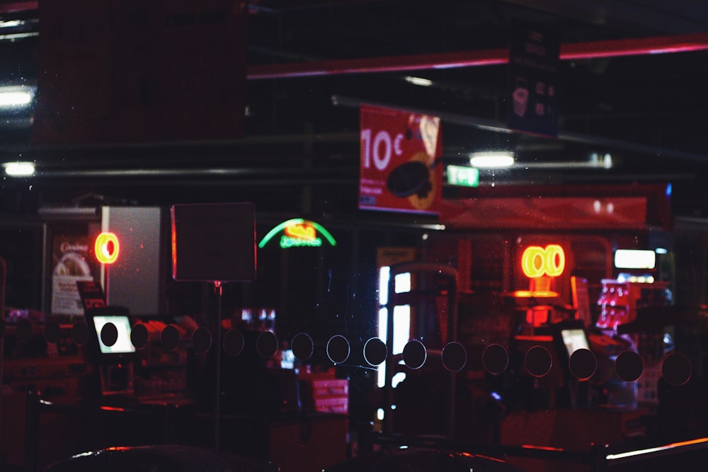 a dark room with neon signs and lights