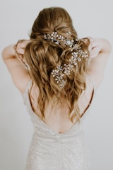 woman standing and touching hair
