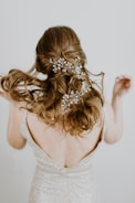 woman in beige open back sleeveless formal dress