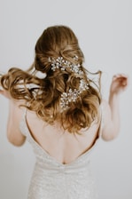 woman in beige open back sleeveless formal dress