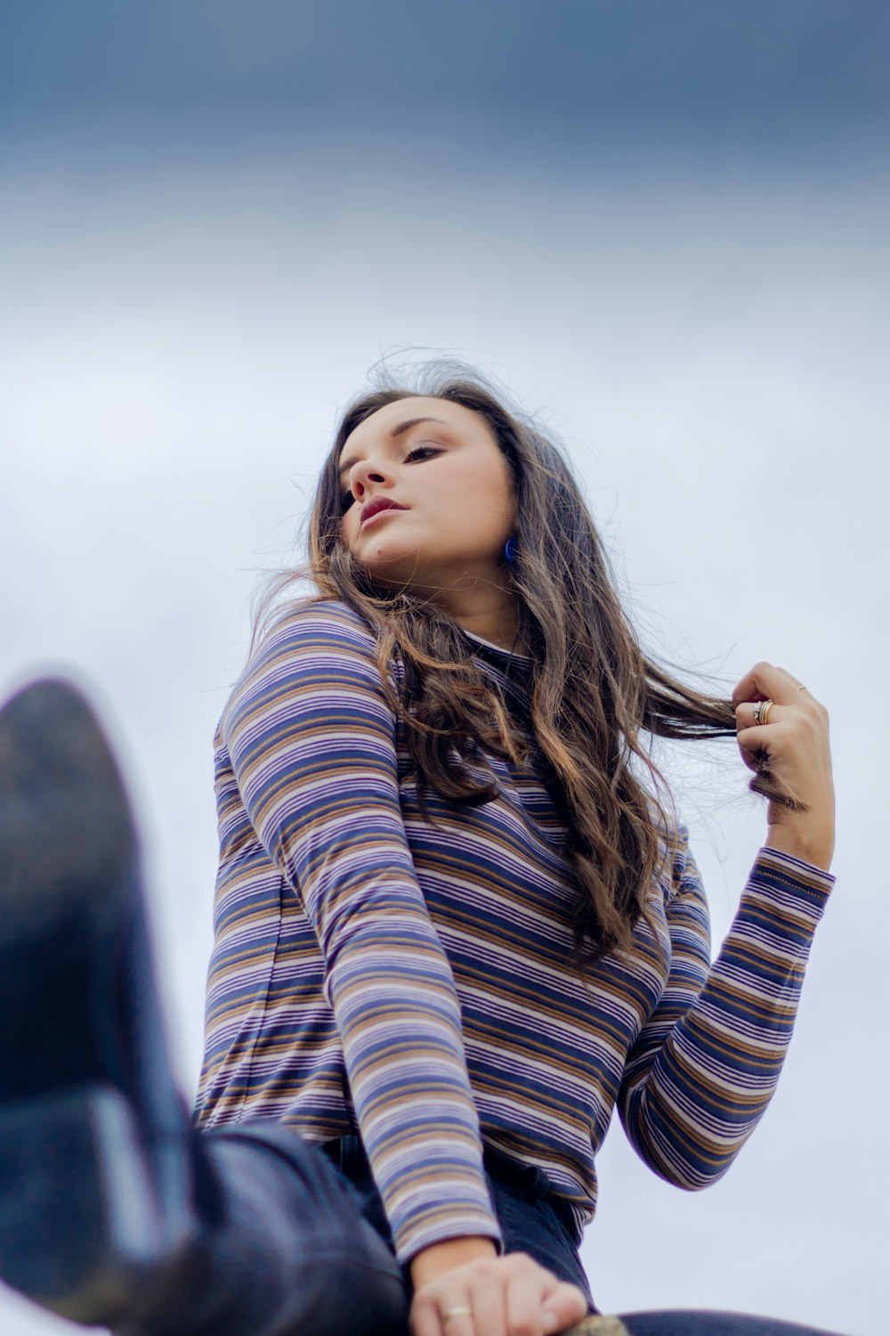 woman wearing purple and beige striped top close-up photography