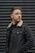 man wearing black denim jacket