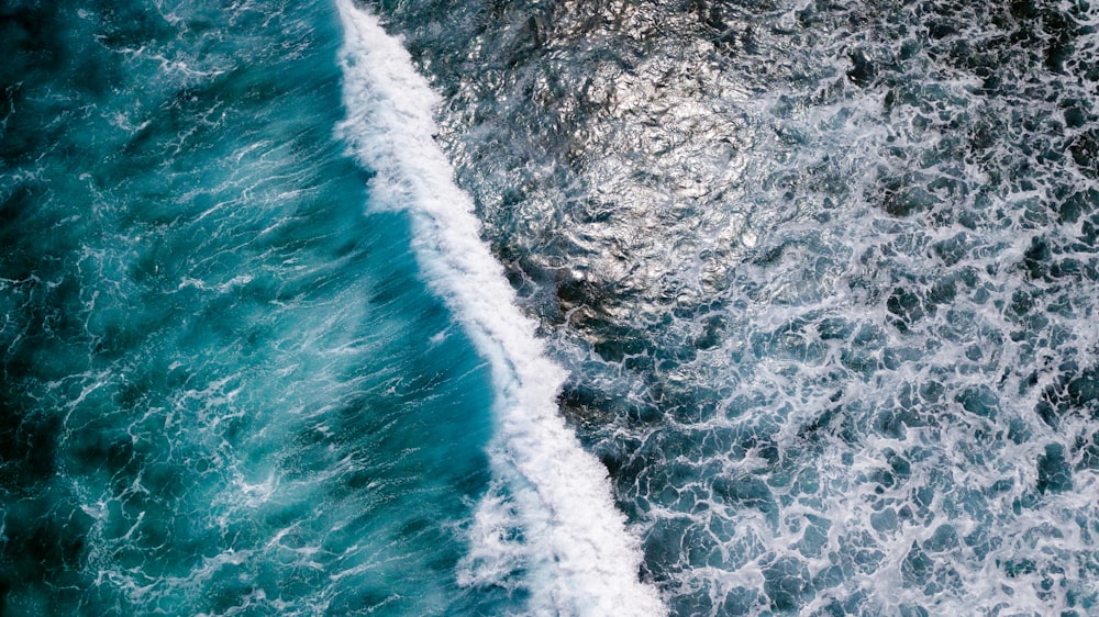 top-view photography of sea waves during daytime