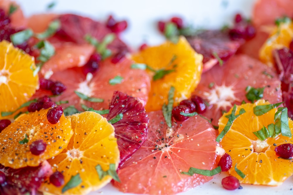 sliced strawberries and oranges