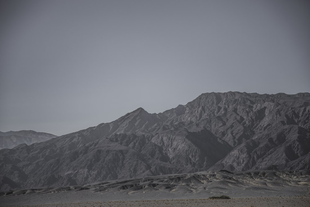 gray mountain under gray sky