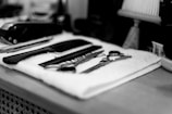 gray stainless steel scissors on towel