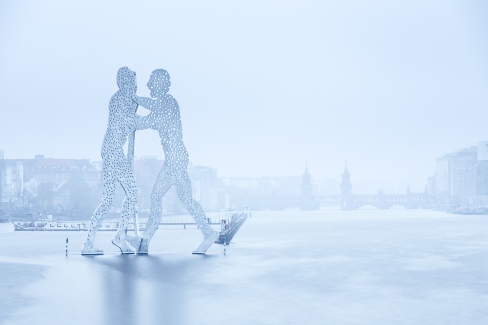 a couple of people that are standing in the snow