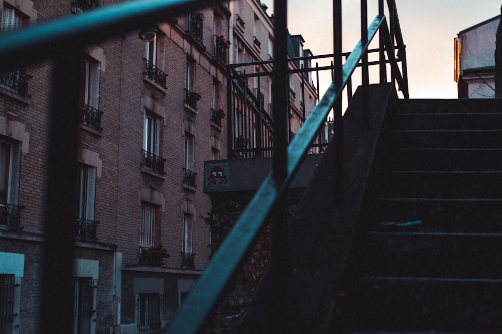 close-up photography of teal and black stairs