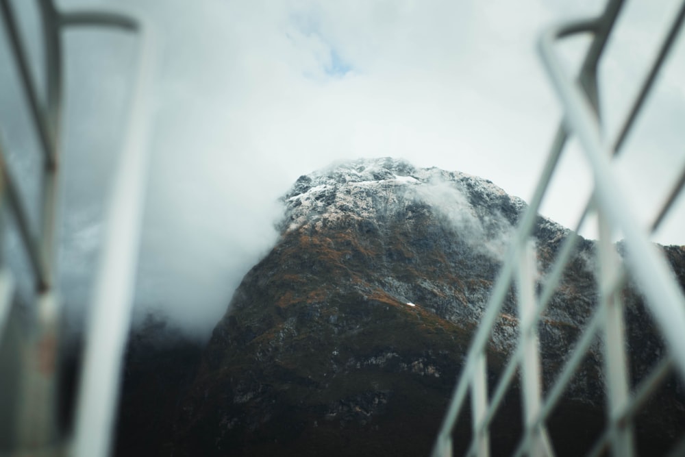 selective focus photography of mountain covered with fog