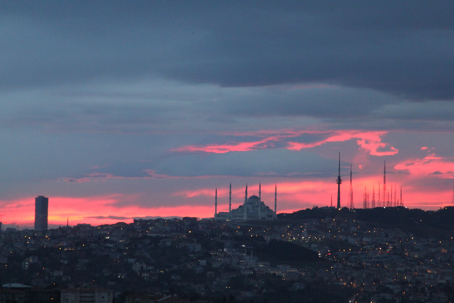 woman wearing yellow long-sleeved dress under white clouds and blue sky during daytime