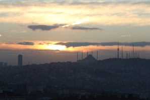 View of the Madinah skyline from the suite balcony at sunset.