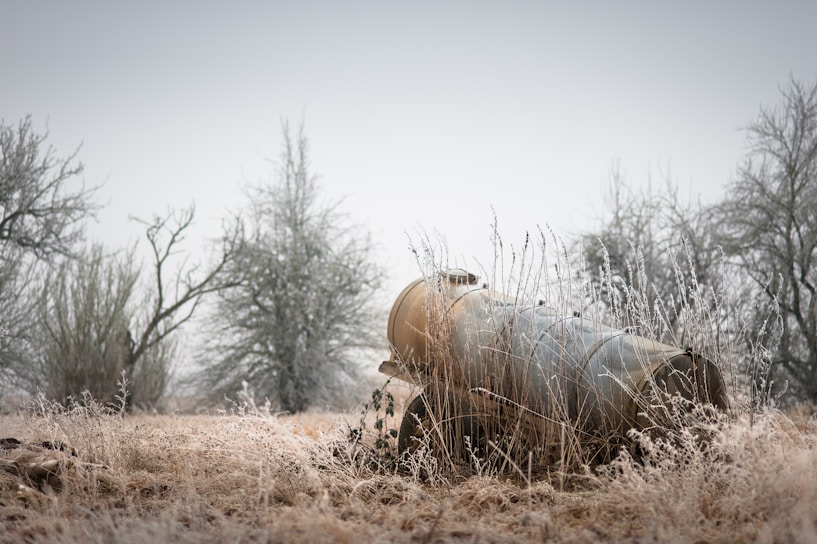 Close-up of a bulltanks cryogenic tank with frost forming on its surface in a farm setting