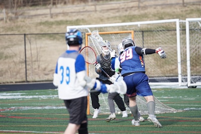 Close-up of a player making a powerful shot towards the goal with intense focus