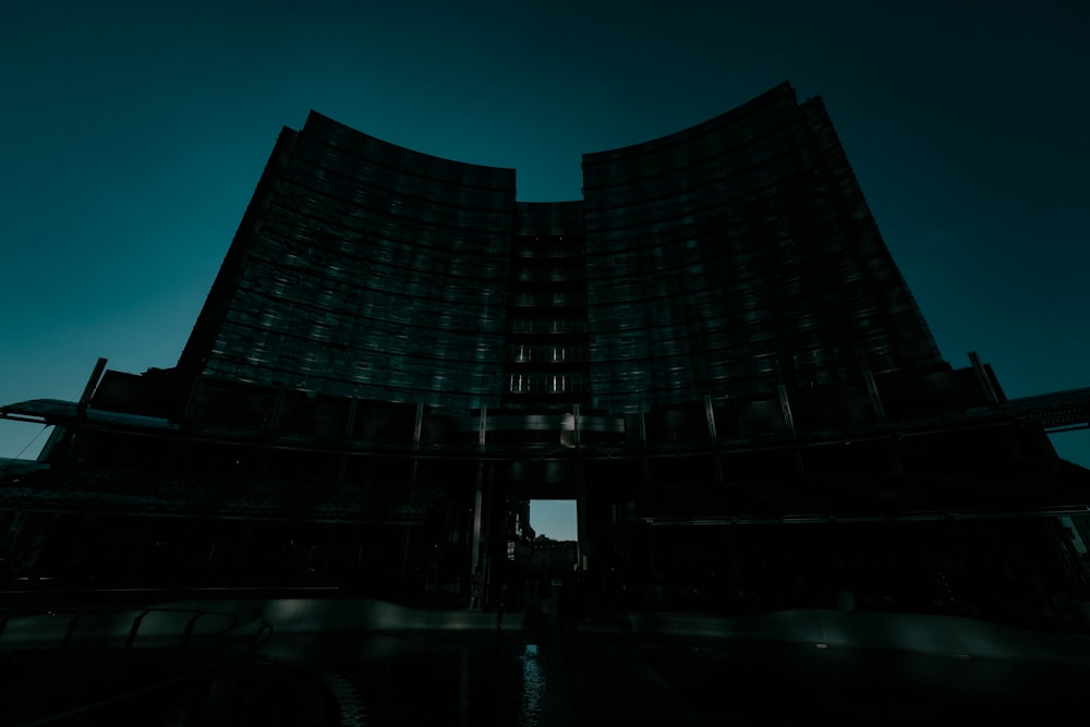 low-angle photography of curtain wall high-rise building at dawn