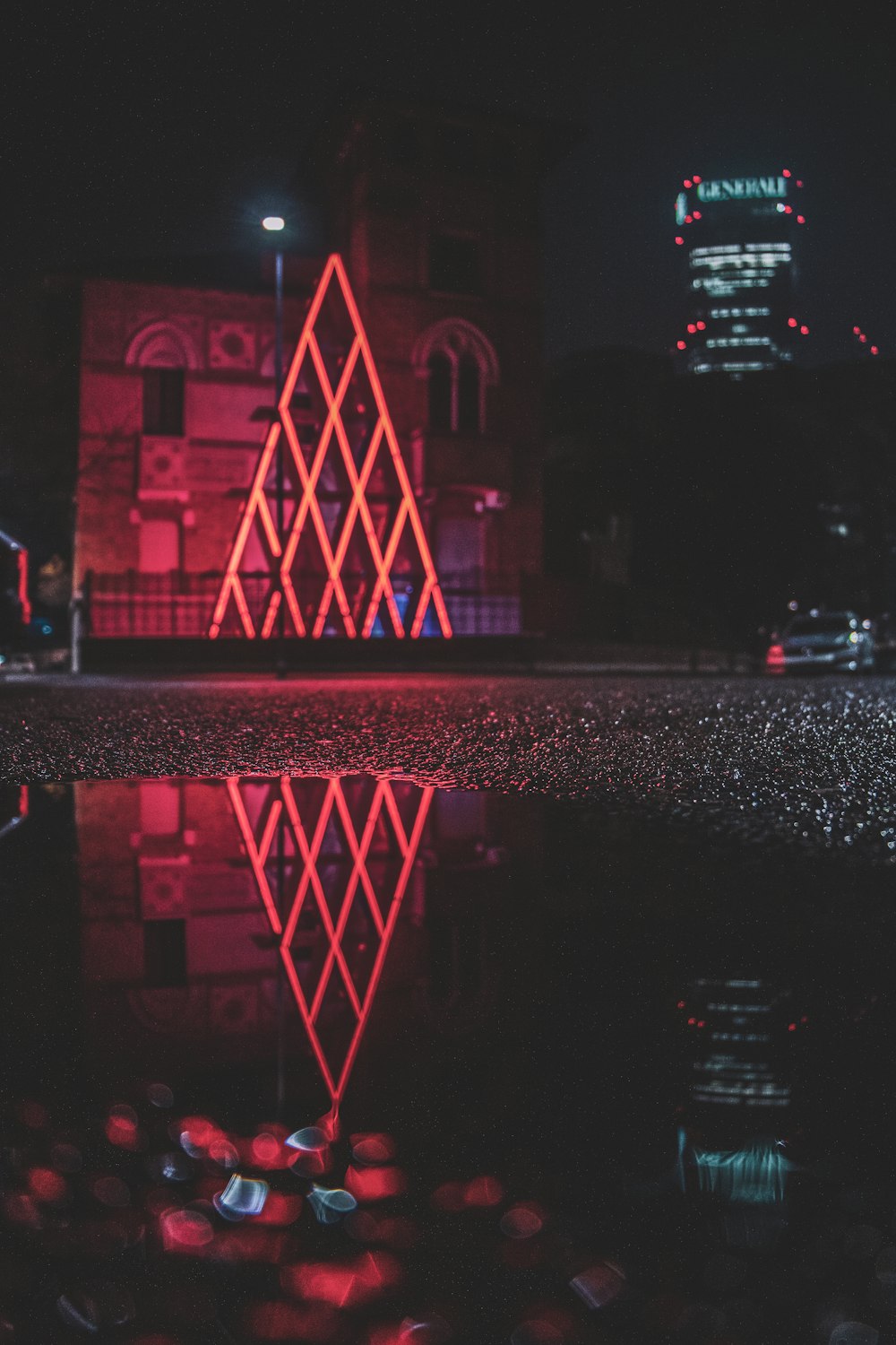 a reflection of a building in a body of water