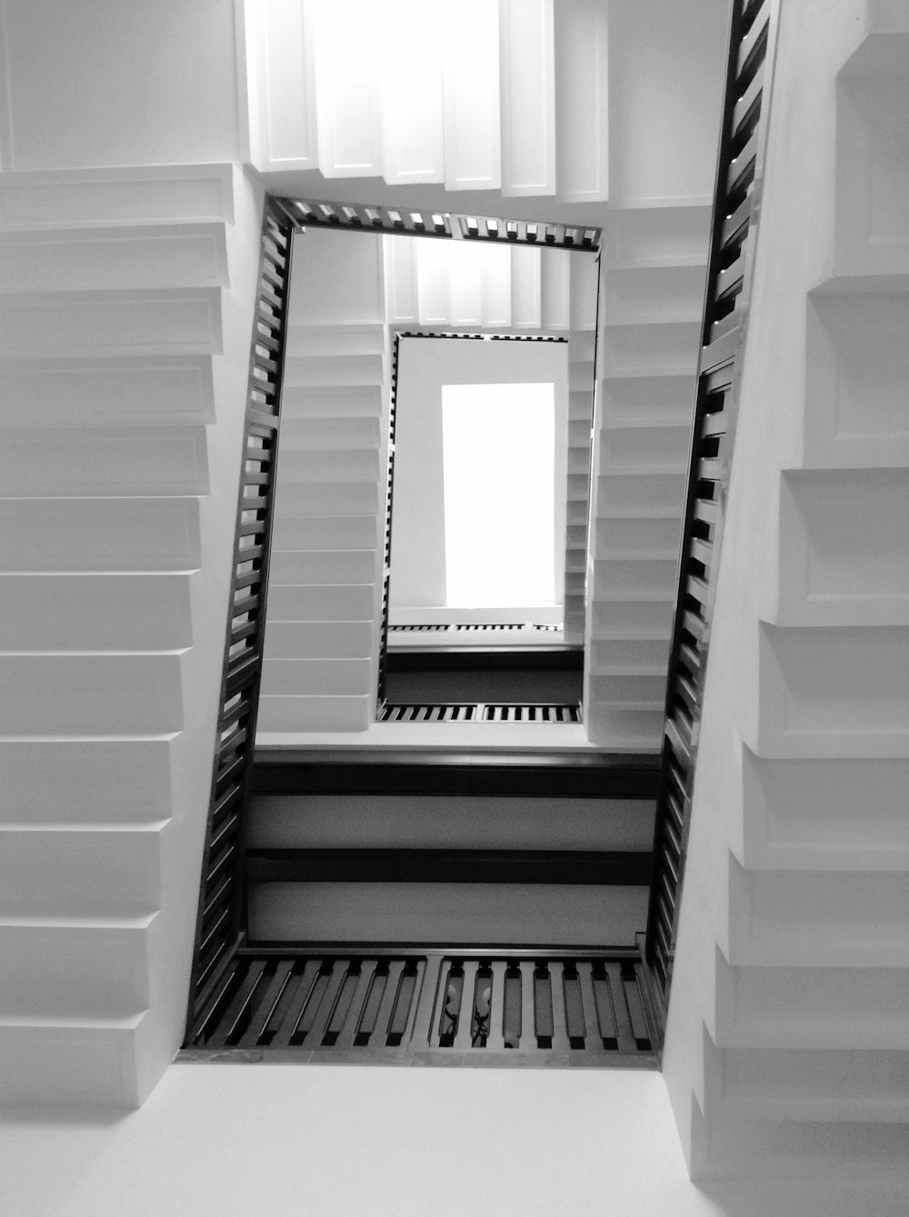 a black and white photo of a window in a building