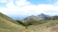 A stunning landscape of rolling hills and greenery.