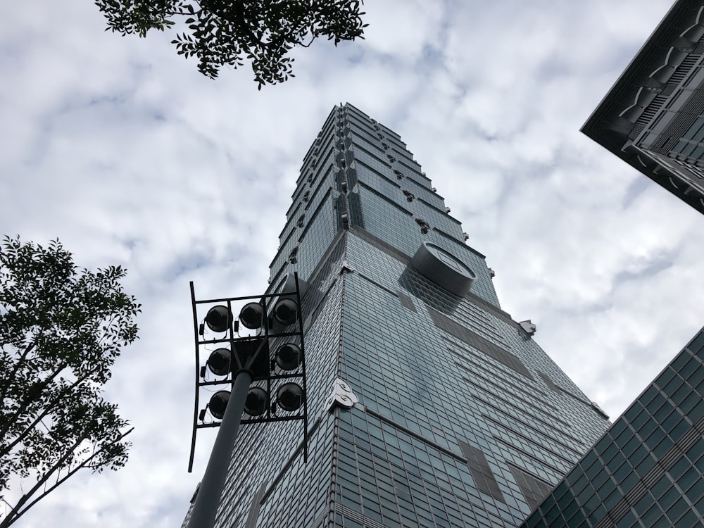 gray concrete building under white cloudy sky during daytime \