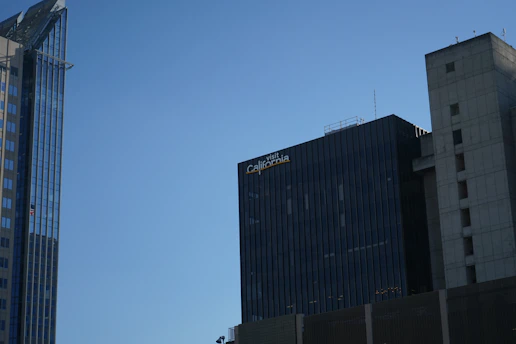 A bustling Los Angeles skyline with highrise buildings under a clear sky, symbolizing growth and opportunity.