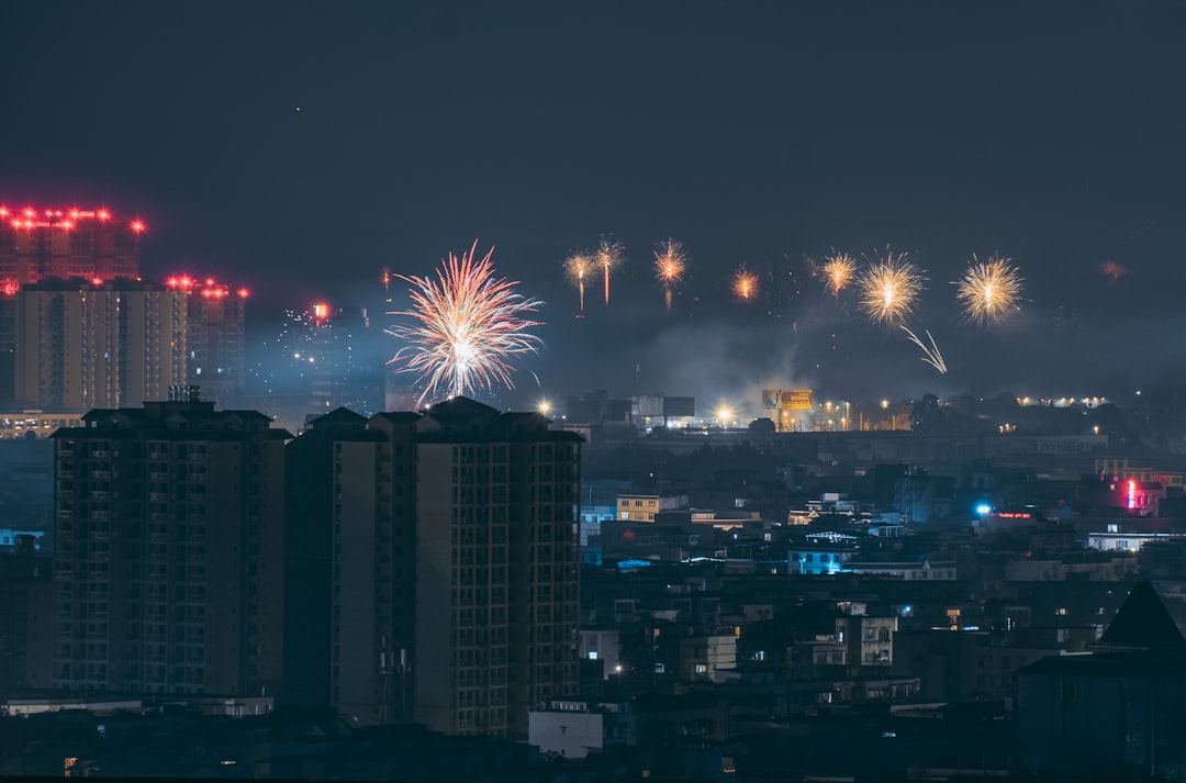 concrete buildings with view of fireworks