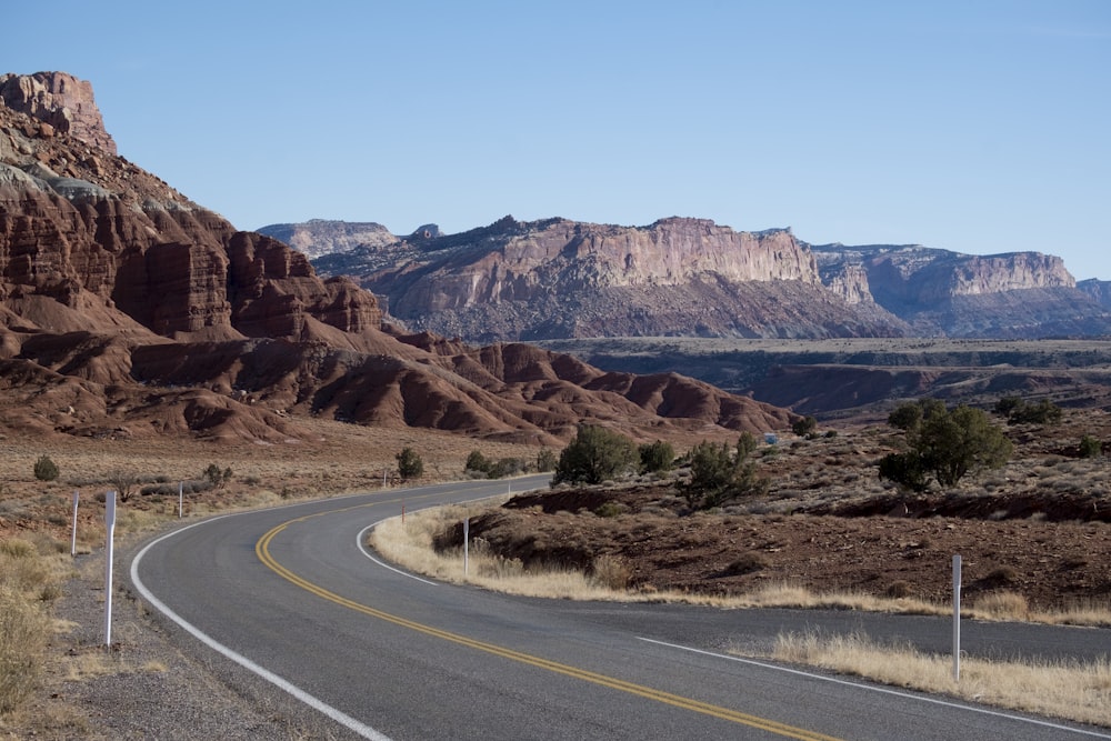 gray concrete road with no vehicle during daytime