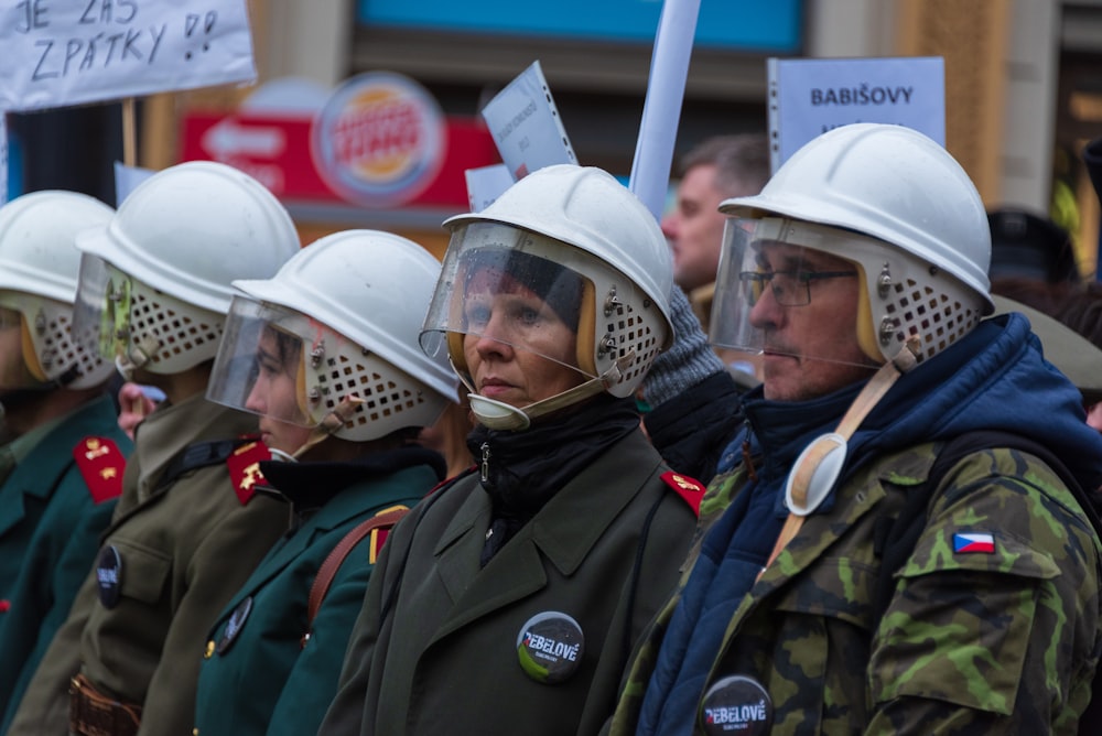 people wearing white helmets