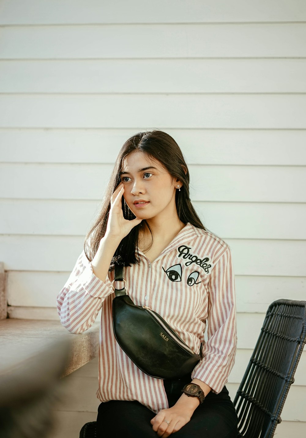 woman standing near white wall