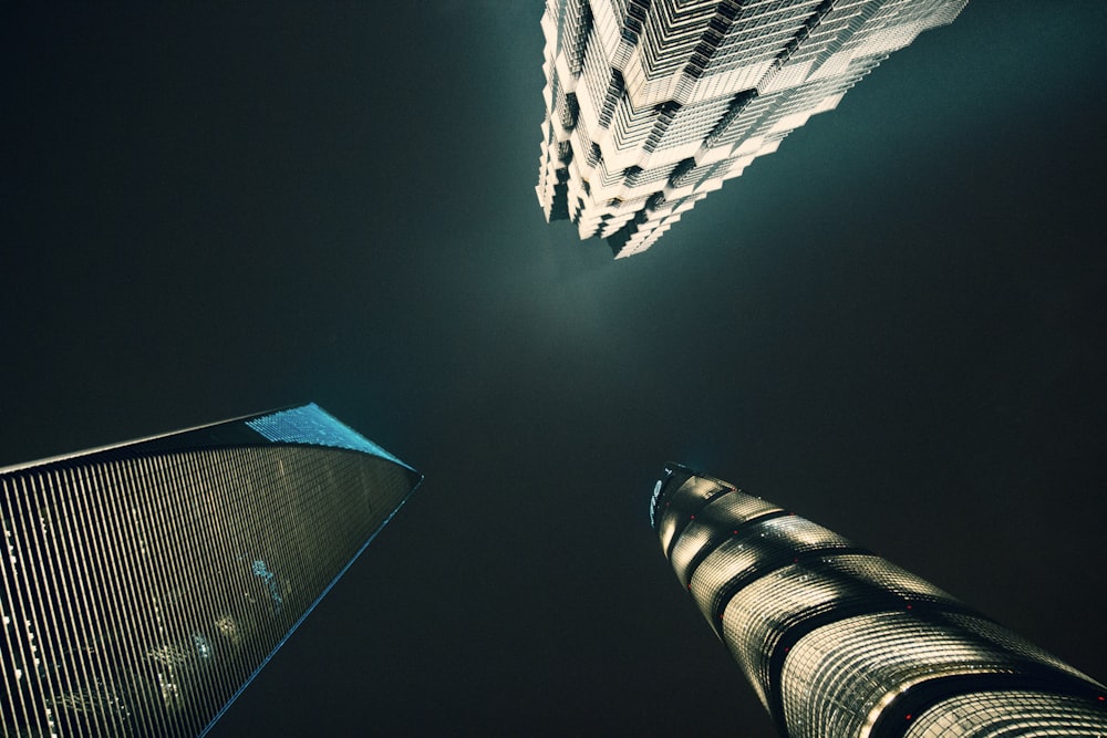 three low-angle photography of buildings