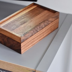 rectangular brown wooden box on table