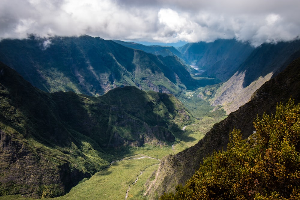 aerial photography of mountain range under cloudy sky during daytime