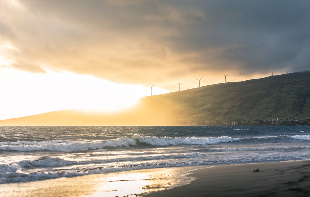 short waves of ocean water during golden hour