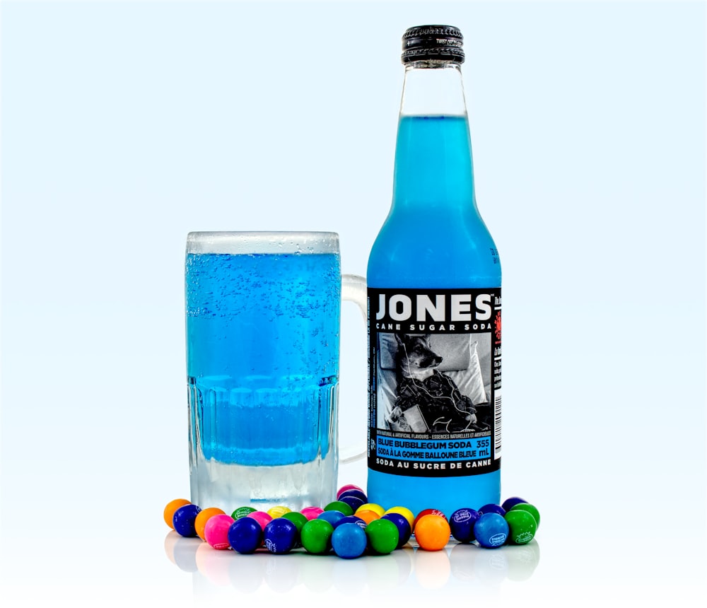 Jones liquor bottle beside glass