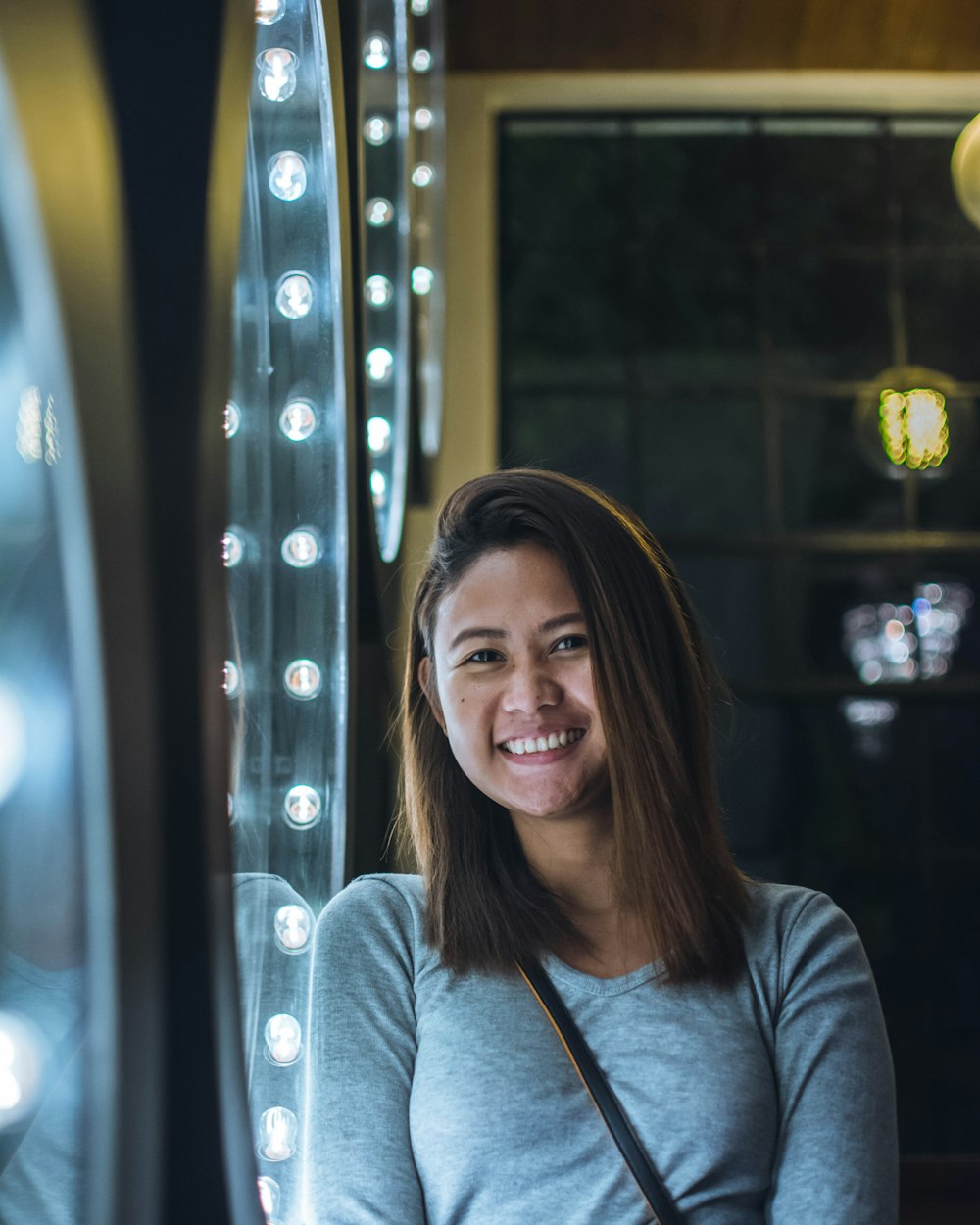 selective focus photography of smiling woman wearing scoop-neck shirt