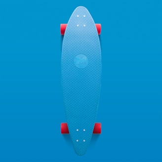 A colorful skateboard deck leaning against a brick wall with graffiti art in the background.