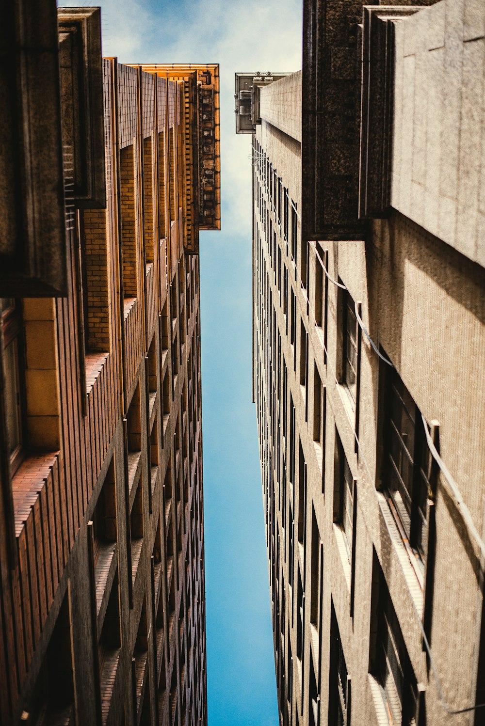 low angle photography of concrete buildings during daytime