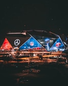 a stadium lit up at night with a lot of lights