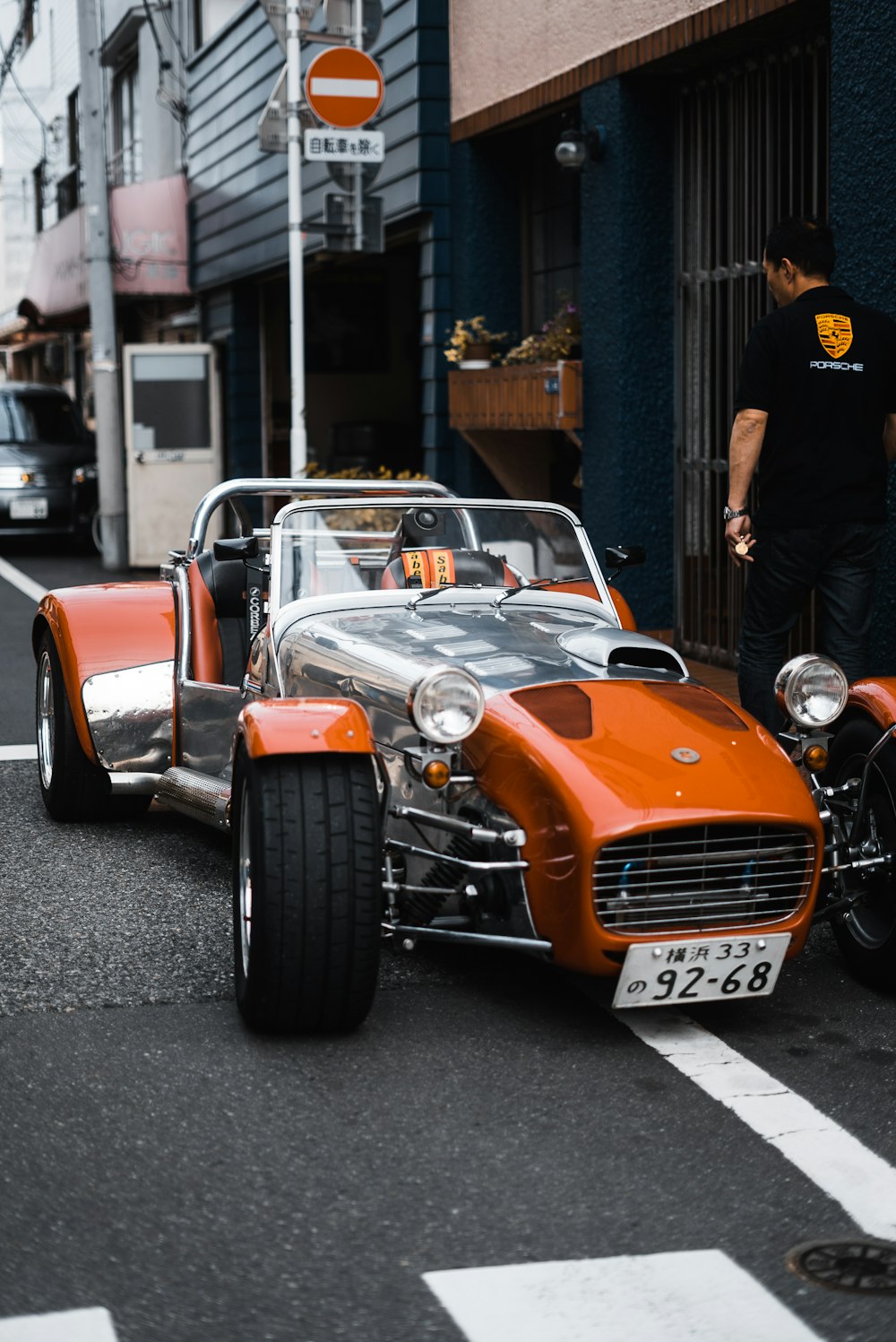 red classic car parking on side