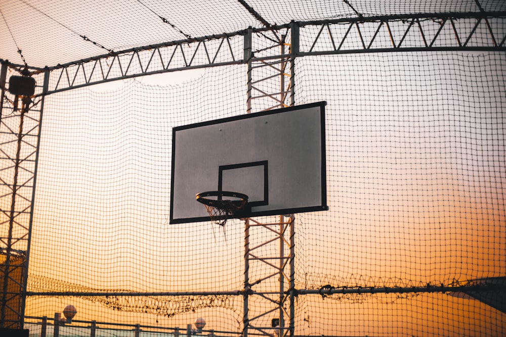 basketball rim during sunset
