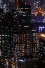 Nighttime cityscape highlighting energy-efficient commercial buildings.