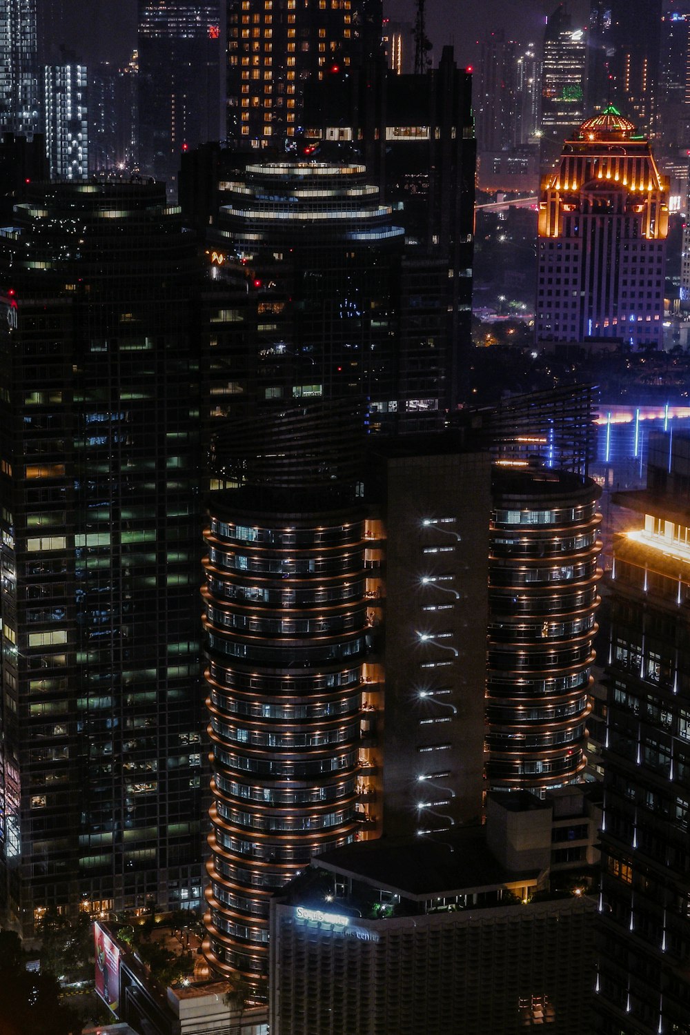 aerial photography of high-rise curtain building at night